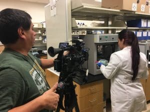 KLRN recording footage in a lab