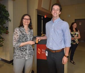 Holden Kelley receiving award