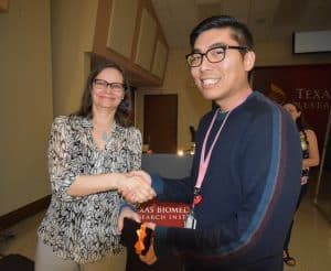 Jeffrey Kim receiving award