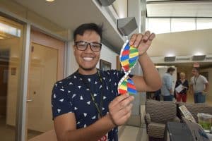 Holding a model at Texas Biomed Family Night
