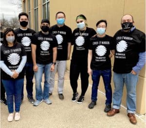 Dr. Luis Martinez-Sobrido stands with members of his lab.