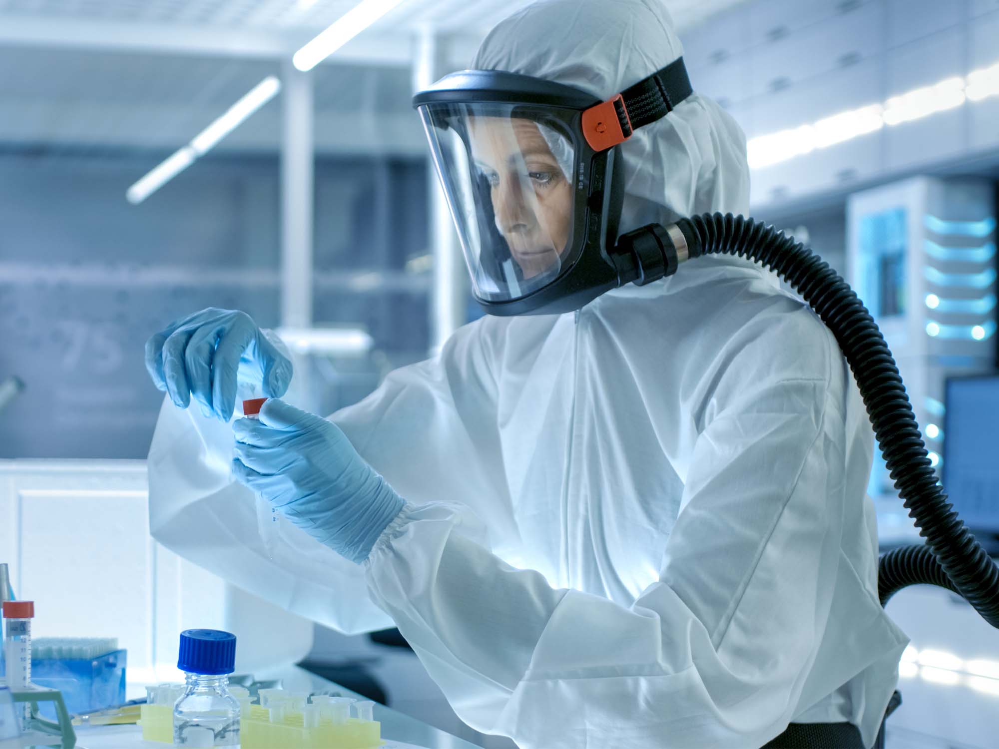 Person in Lab in biohazard suit
