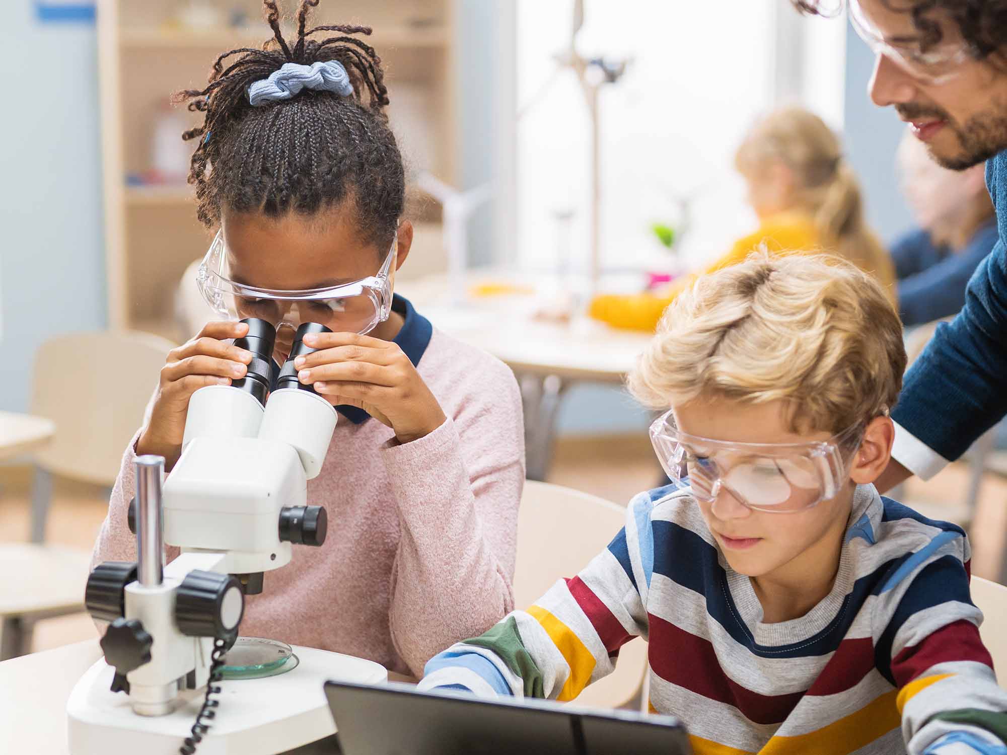 Kids looking into microscope