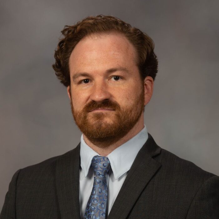 headshot of man in suit